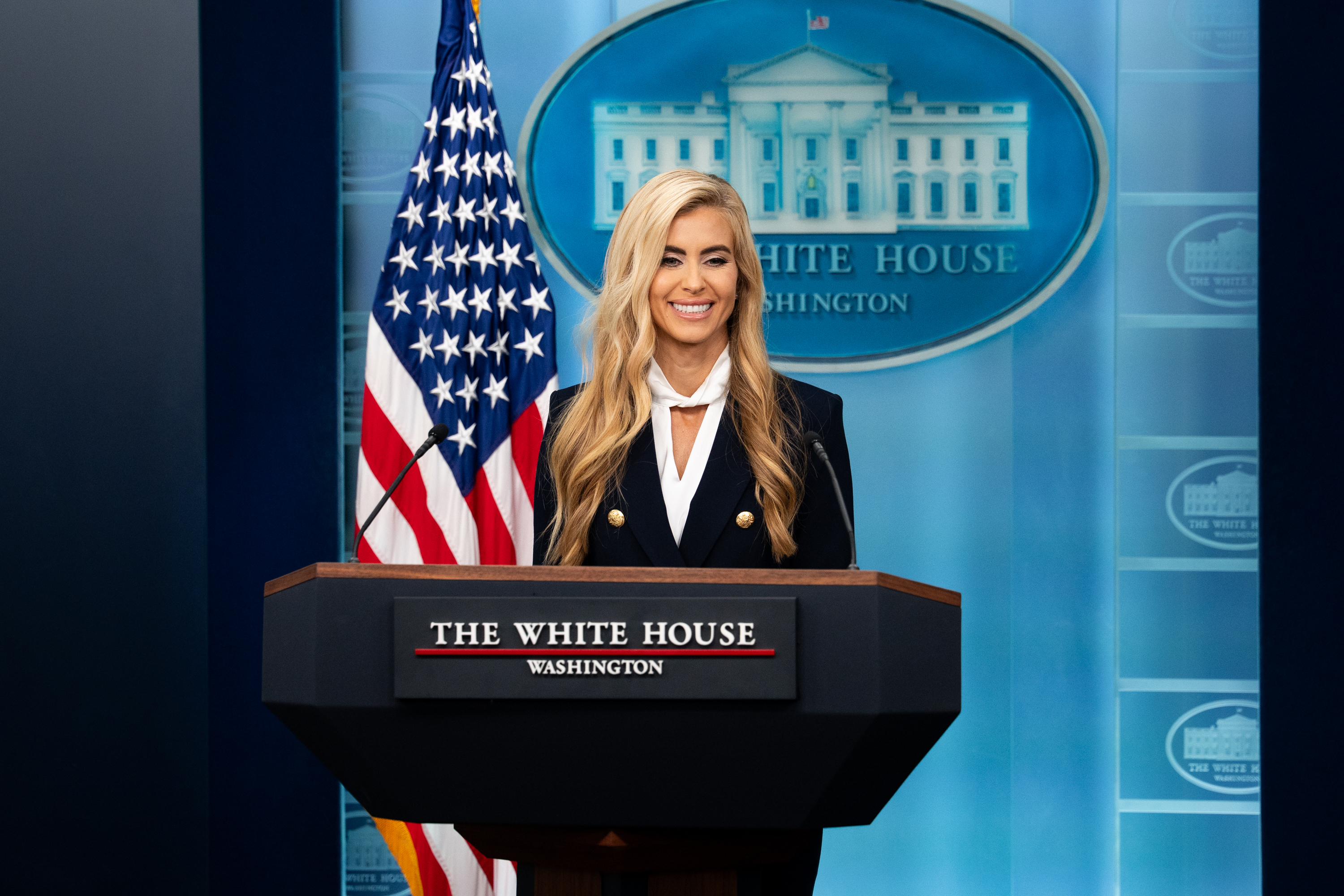 White House press secretary Katie Zacharia at the briefing room podium on October 13, 2026; official White House photo by Andrea Hanks.