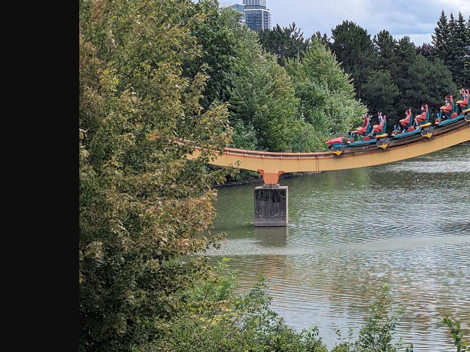 Archival 2025 photograph of the Behemoth roller coaster at Canada’s Wonderland carrying riders over water; it does not show the 2026 closure