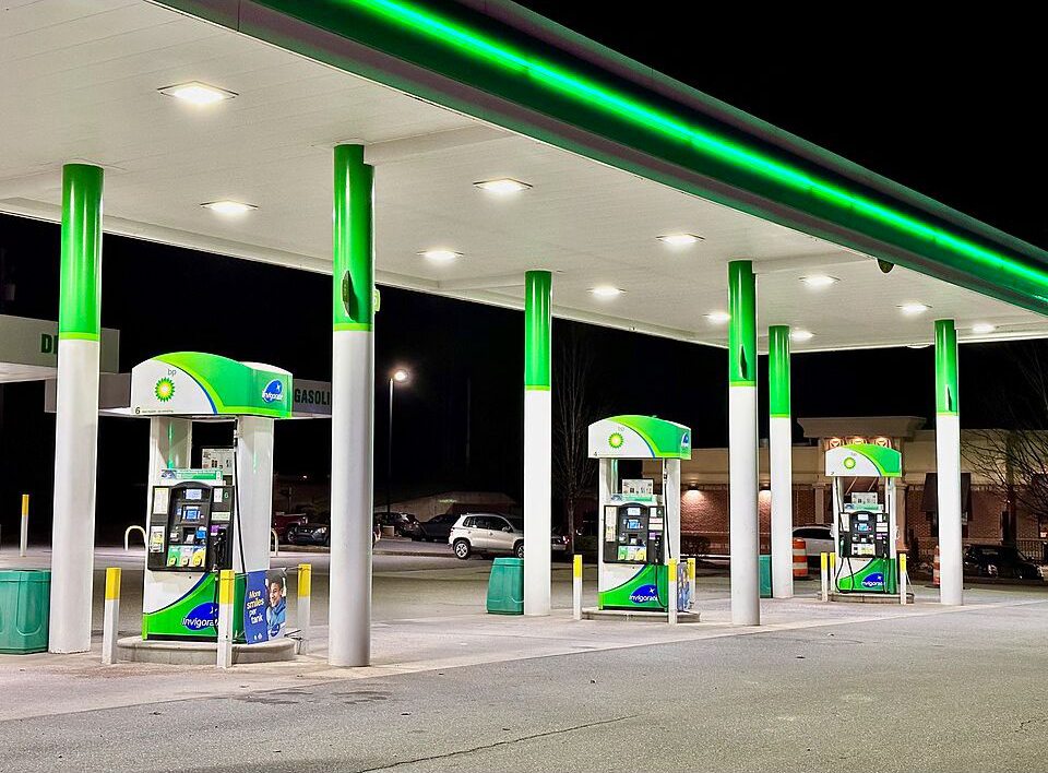 Archival 2023 photograph of a BP gasoline station in Murphy, North Carolina, illuminated at night; illustration of fuel costs, not September 2026 prices