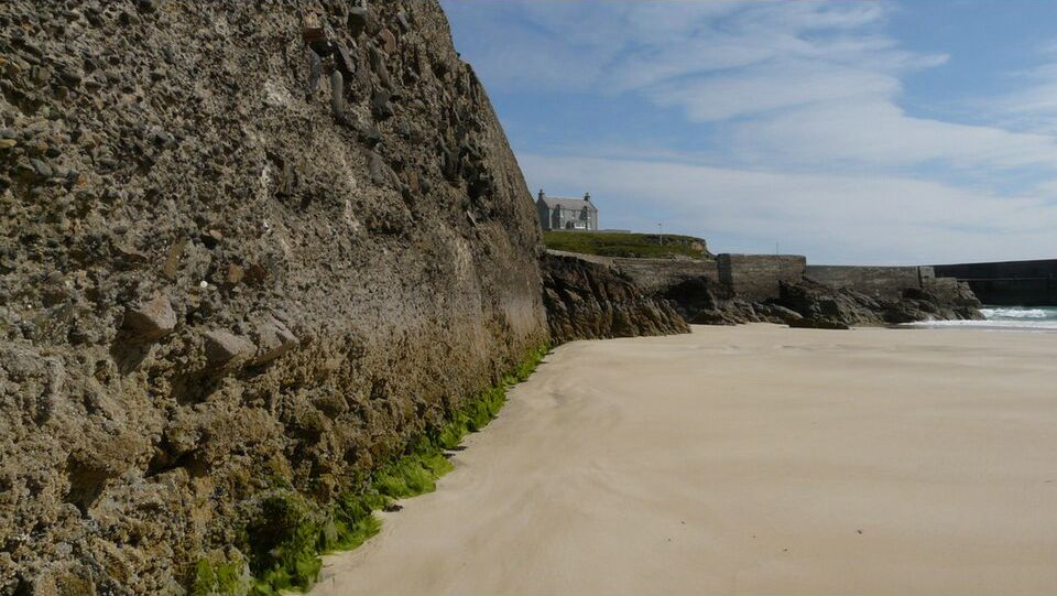 Archival 2012 view of the coast and harbour wall at Port of Ness on the Isle of Lewis; this does not show the missing vessel or current search
